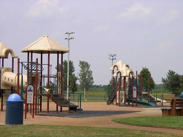 A colorful playground featuring a slide - Copy
